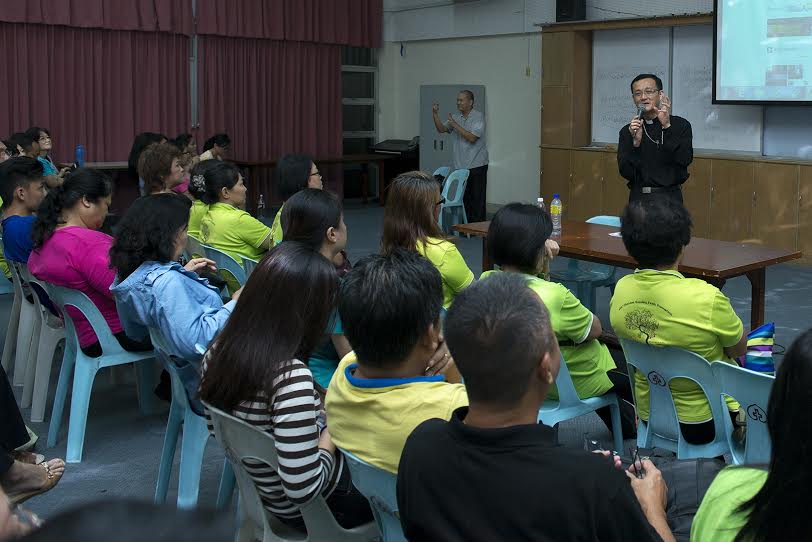 The participants listen attentively to the speaker Abp Wong.