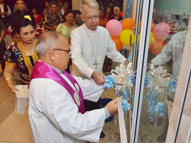 Bishop Julius and Abp Marino cut the ribbon to open the centre.