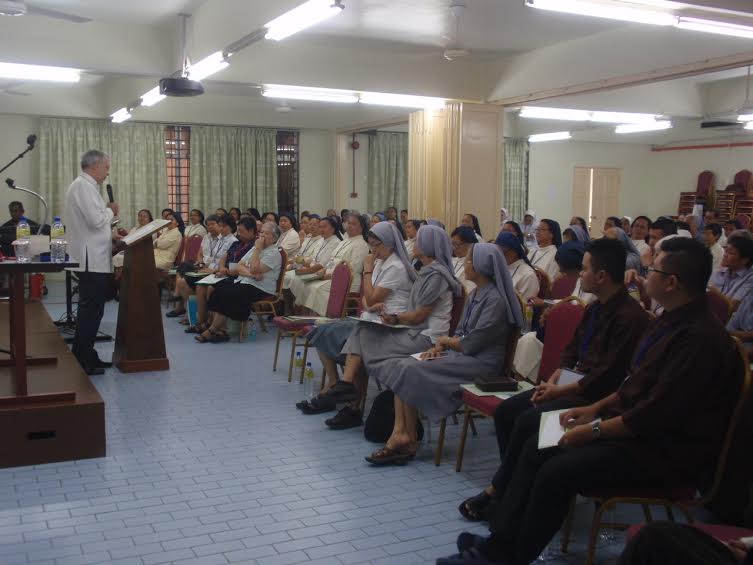 The participants listen intently to the Apostolic Nuncio's address.